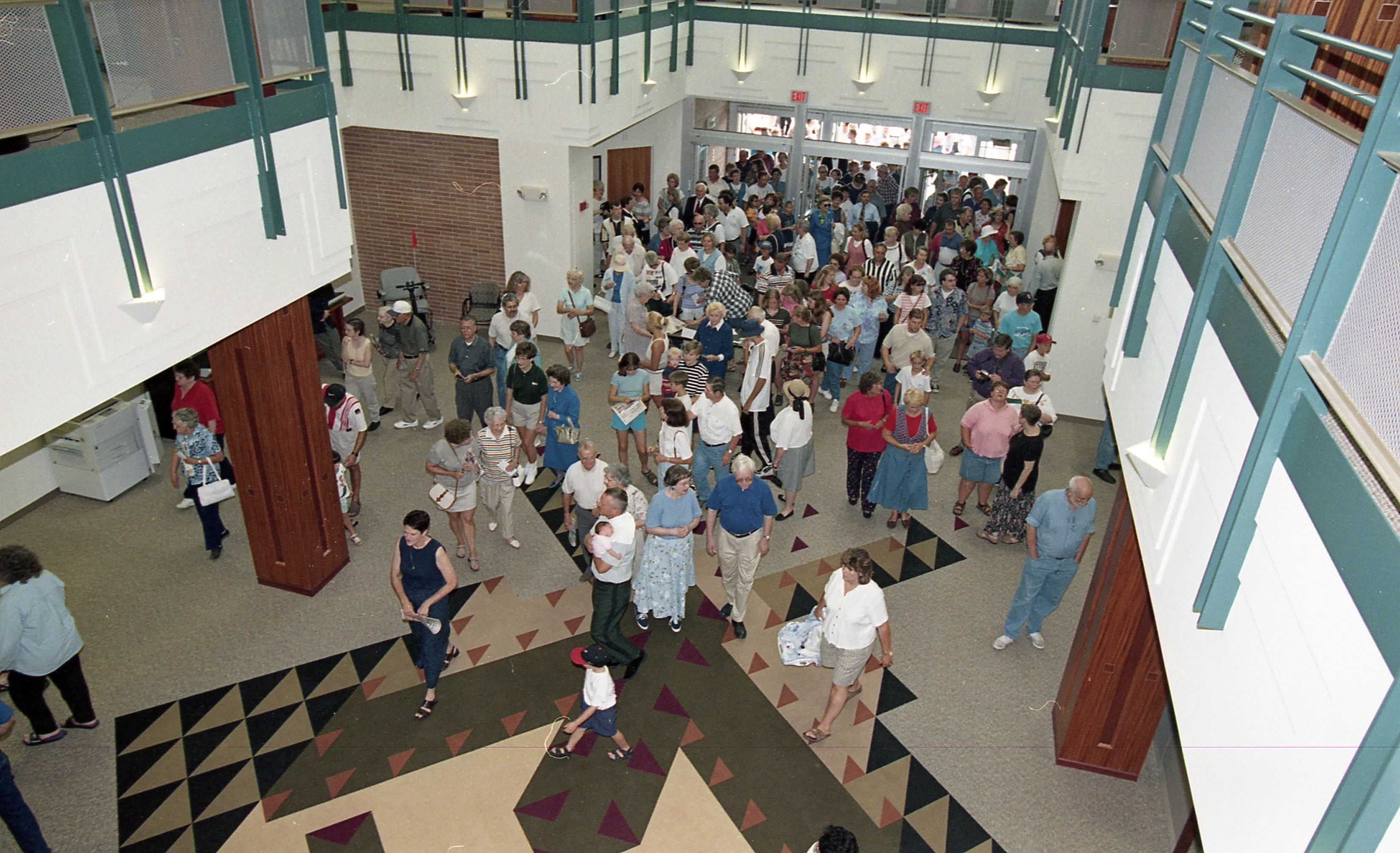 People entering doors of library