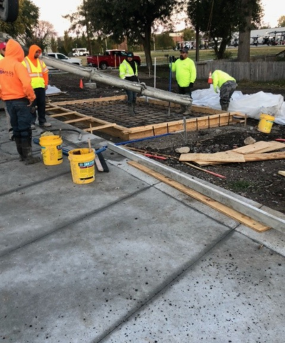 Crew pouring cement