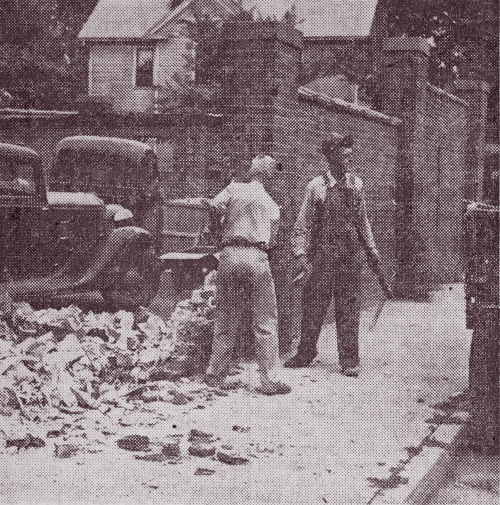 City workers demolishing a brick wall, Daily Nonpareil July 24, 1946