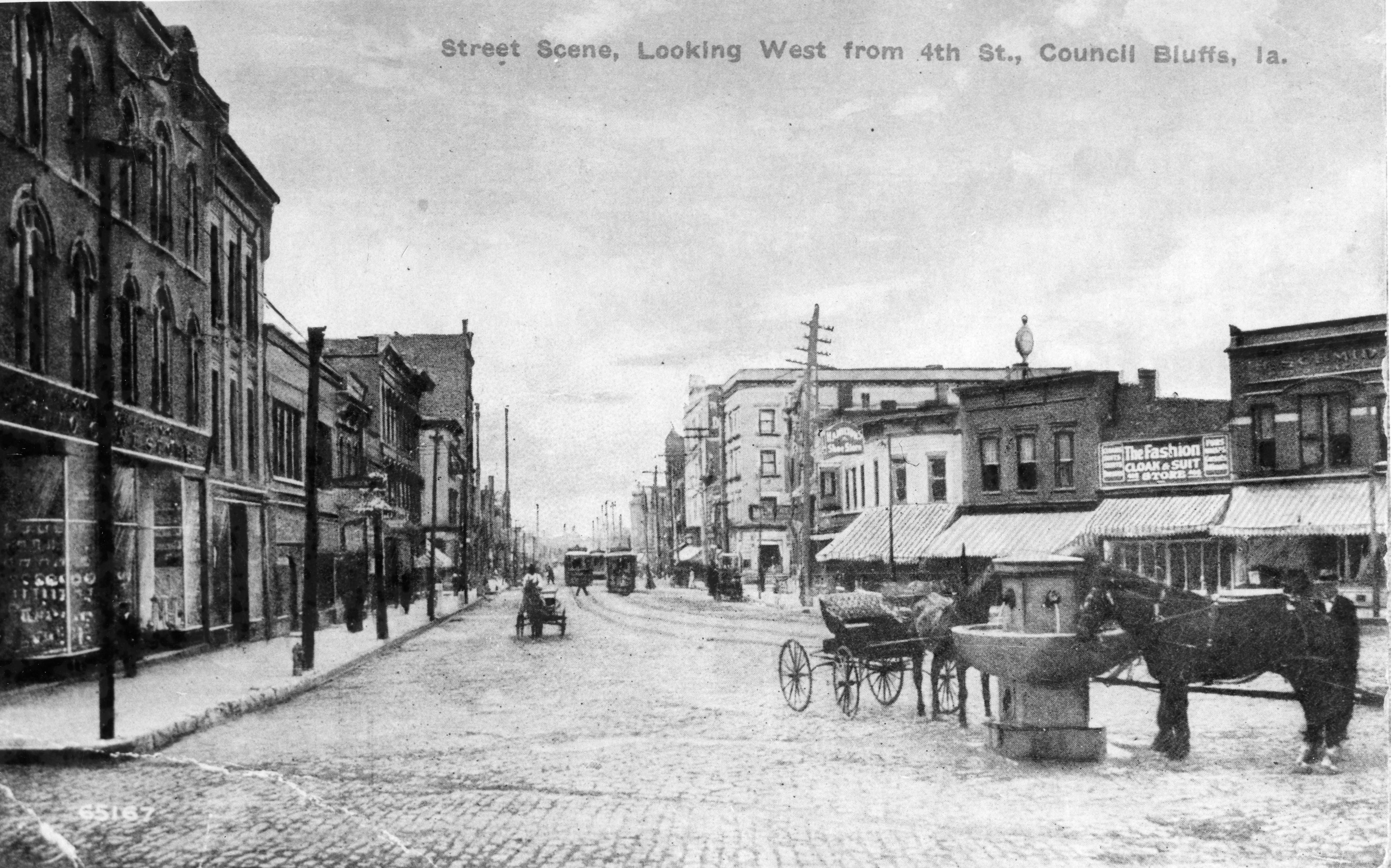 View of Broadway and 4th St. looking west with the water trough in the foreground