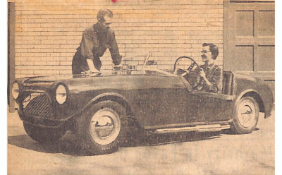 A photo of Alfred Clemens standing by his car with his wife, Mrs. Clemens, in the driver's seat