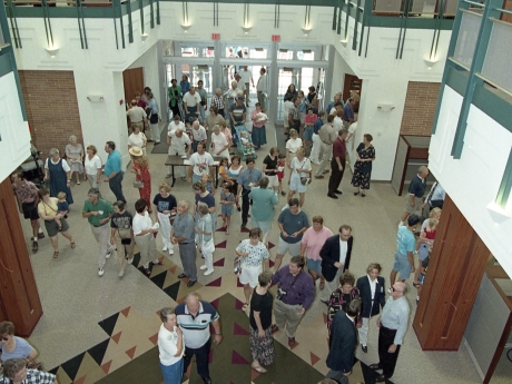 People entering doors of library
