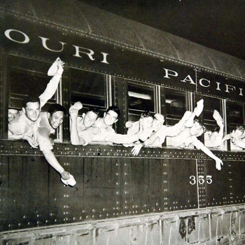 An American troop train leaving a Midwestern military camp