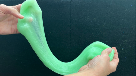 Person stretching slime.