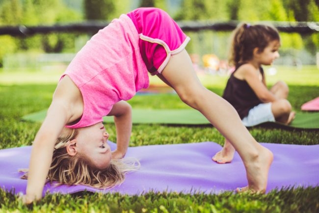 Child in a yoga pose.