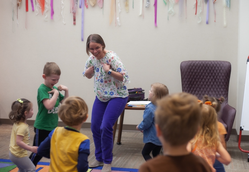 Miss Anna dancing with kids.